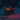 Two dogs sitting in the snow wearing glowing red LED dog collars at night in a snowy park.