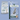 Two Arden Grange dog food packages on an pale blue background, demonstrating the recent change in packaging.