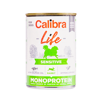 A can of Calibra Life Sensitive Monoprotein dog food, designed for dogs with sensitive stomachs. The can features a white label with green and orange text, a green silhouette of a dog, and illustrations of salmon oil, rabbit, and hypoallergenic icons.