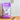 A 12 kg bag of Calibra Veterinary Diets Ultra Hypoallergenic Insect Protein dog food stands on a wooden floor next to a small white bowl filled with kibble, set against a white kitchen cabinet background.