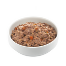 White background with a white bowl of Edgard and Cooper wet puppy food pictured.
