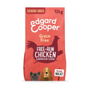 White background with an red bag of Edgard & Cooper Senior Dog Dry Food Chicken and Salmon pictured. On the packet is an illustrated French Bulldog and Cocker Spaniel. Text on the pack reads, 'Edgard & Cooper.' A silhouette of a chicken has text inside 'Magnificent free-run Chicken & Norwegian Salmon' and 'Grain Free' above.