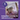 Cat being held with a hand on a purple background, text about feline stress expertise and calming for cats and kittens.