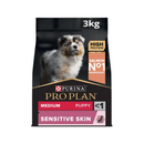 White background with a black bag of Purina Pro Plan Medium Puppy Sensitive Skin. Pictured on the bag is an collie puppy.