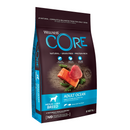 White background with a picture of a bag of Wellness CORE Ocean Dog Food. On the bag is pictures of Salmon fillet, tuna fillet and peas. The text on the bag 'Wellness CORE, Natural, Grain Free, Protein-Rich' and 'Adult, Medium/Large breed, Original, Salmon with Tuna Recipe'.