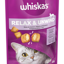White background with a close up of a purple packet of Whiskas Relax & Unwind Treats, on the packet is silver tabby cat's face under a purple blanket. Text on the pack reads 'Whiskas Relax & Unwind, with a relaxing amino acid for calmness.'