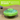 UFO shaped treat dispenser with green central and top parts with main body in grey on a laminate floor. A bright green banner with white text say 'Difficulty Upgrade. Decide how long your dog will be playing by adjusting the size of the treat dispensing opening.'