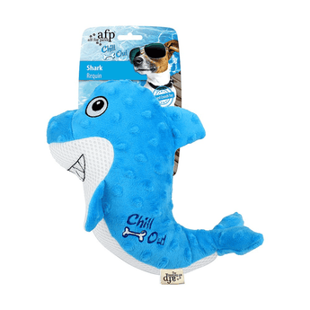 Blue and white shark dog toy with stitch detail of teeth and eye on the face and stitch detail of a dog bone and text 'Chill Out' on the side of it's tail, packaged onto cardboard backing. On a white background.