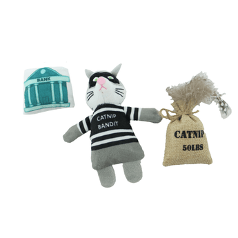 An Ancol plush cat-shaped toy dressed as a bandit with a black-and-white striped shirt, shown with a small burlap sack labeled 'CATNIP 50LBS' and a teal-and white bank box on a plain white background.