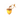 A small acorn-shaped LED light for a dog collar with a warm yellow body, brown cap, and tan loop, shown on a plain white background.