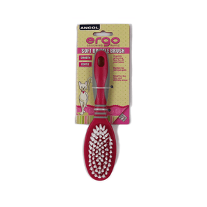 White background with a pink and grey Ergo Soft Bristle Brush for cats, attached to a cardboard backing.
