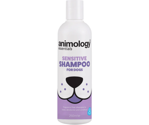 White background with a white and lilac 250ml bottle of Animology Essentials Sensitive Shampoo for Dogs. On the bottle is an illustrated muzzle with white text below 'Fragrance free shampoo to clean, deodorise and condition.'