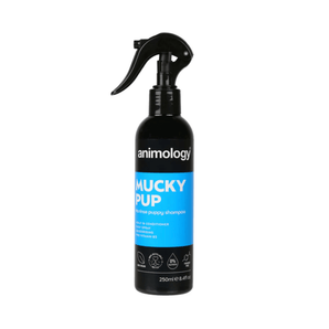 White background with a black and blue spray bottle of Animology Mucky Pup Shampoo. On the bottle is white text 'Animology Mucky Pup, No rinse puppy shampoo'.