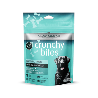 A 225g stand-up pouch of Arden Grange Crunchy Bites light dog treats with fresh chicken, featuring a teal and black design with a black dog photo on the front.