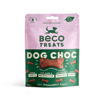 White background with a packet of Beco Dog Treats pictured. On the packet is an illustrated silhouette of a running dog. Text on the pack reads, 'Beco Treats, Dog Choc' with a picture of a bone shaped treat, text below reads 'with Carob, Chamomile & Quinoa, Tail Waggingly Tasty.'