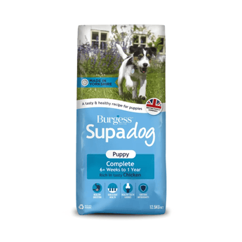 White background with a bag of Burgess Supadog Puppy dry food. On the bag is a Jack Russell puppy running in a garden. Text on the bag reads 'Burgess SupaDog,Puppy Complete, 6+ weeks to 1 year, with tasty chicken'.