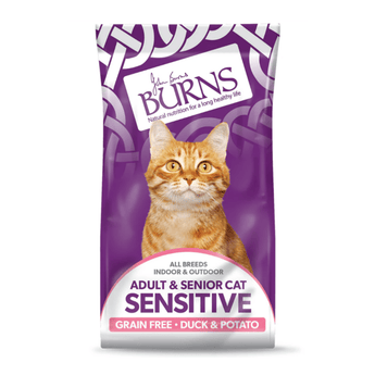 White background with a purple bag of Burns Sensitive Adult Cat food. On the bag an adult ginger tabby cat is pictured with text 'All Breeds, Indoor & Outdoor, Adult & Senior, Sensitive, Grain Free, Duck & Potato'.