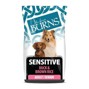 White background with a bag of Burns Sensitive Duck dry dog food, pictured on the bag is a Sheltie and a Dachshund below is text 'Sensitive Duck & Brown Rice, Adult/Senior Dogs'.
