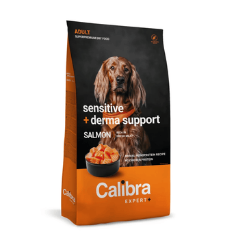 A bag of Calibra Expert+ dog food, 'Sensitive + derma support' salmon recipe, featuring a brown long-haired dog on a black and orange background.