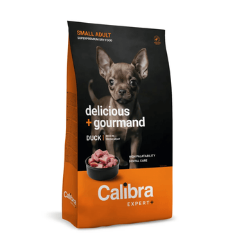 Calibra Expert+ small adult duck dry dog food in a 12kg bag. The packaging features a black upper section with a photo of a small brown dog, and an orange lower section with the brand name 'Calibra Expert+' in white text.