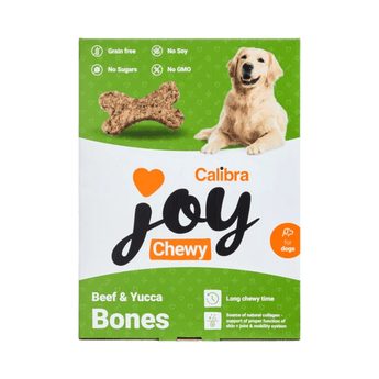 Calibra Joy Chewy Beef & Yucca Bones dog treats packaging box, featuring a golden retriever and a bone graphic on a white and green background.