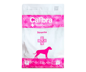 A bag of Calibra Veterinary Diets Struvite dog supplement, featuring a white and bright pink design with a dog silhouette.