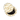 White background with a round cream cat bed with brown pawprints with the centre cushion partially removed.