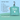 Blue and green background with a green zipped up square-shaped bag for a Charlie the Vet Mini Pet First Aid Kit, with a list of what the kit can be used for next to it.