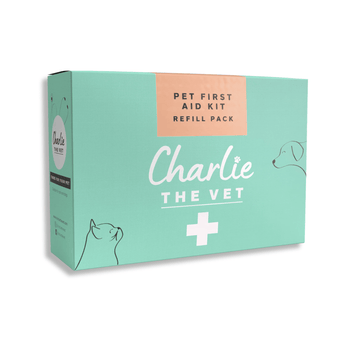 White background with a green box of a Charlie the Vet Pet First Aid Kit Refill Pack, on the box is an illustrated cat and dog.