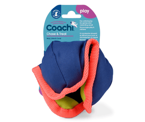 White background with a coral, navy and lime green Coachi Tuggi Chase & Treat dog toy, attached to a blue cardboard tag.