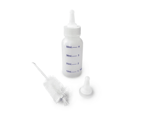 White background with a CVET nursing bottle with a brush and cap in front of the bottle.