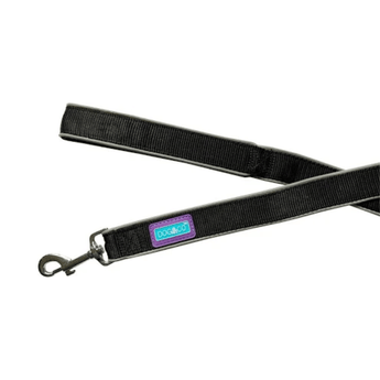 White background with a Dog and Co Padded Reflective Nylon lead in black with reflective edging and stitching. With a purple tab with 'Dog & Co.' written on it.