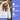 Spaniel type dog wrapped in a white Eco Towel, with a hand holding the towel. A box of DOT DOT PET Eco Towels in the bottom left corner. To the right of the image is a blue banner with white text '100% natural & Biodegradable, Highly absorbent & Quick drying, For every type of dog.'