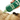 Hand holding a green bottle of Earth Rated Short Coat Dog Shampoo whilst applying it to a pug's short coat.