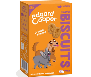 White background with an orange box of Edgard & Cooper Chicken Biscuit treats pictured. On the box is an illustrated French Bulldog and Cocker Spaniel. Text on the pack reads, 'Edgard & Cooper, Chicken Bravo Biscuits, No added sugar, Yes Really', above the dogs, text next to it reads 'Crunch, crunch'.