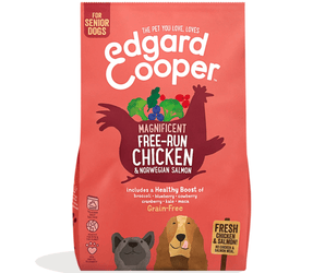 White background with an red bag of Edgard & Cooper Senior Dog Dry Food Chicken and Salmon pictured. On the packet is an illustrated French Bulldog and Cocker Spaniel. Text on the pack reads, 'Edgard & Cooper.' A silhouette of a chicken has text inside 'Magnificent free-run Chicken & Norwegian Salmon' and 'Grain Free' below.