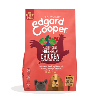 White background with an red bag of Edgard & Cooper Senior Dog Dry Food Chicken and Salmon pictured. On the packet is an illustrated French Bulldog and Cocker Spaniel. Text on the pack reads, 'Edgard & Cooper.' A silhouette of a chicken has text inside 'Magnificent free-run Chicken & Norwegian Salmon' and 'Grain Free' below.