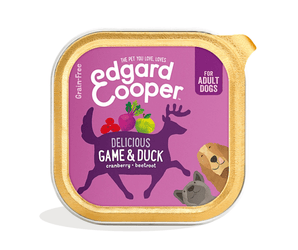 White background with a tray of Edgard and Cooper wet dog food pictured. Text on the foil of the tray says 'Bio Organic, Delicious Game & Duck, Cranberry, Beetroot.'