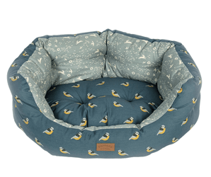 Dog bed with bird pattern on a white background