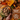 A styled flat-lay of a Forthglade turkey wet dog food ingredient blend on a rustic wooden table, featuring cubed brown meat pieces in a bowl, sliced sweet potatoes, a raw chicken leg, carrots, peas, and other ingredients with text overlays reading 'sweet potato & wholesome veg' and '60% single source turkey, lighter recipe'.