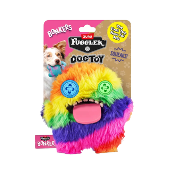 Bonkers Fuggler Dog Toy in its original retail packaging. The product is a highly colourful, furry monster dog toy with rainbow stripes (yellow, orange, green, blue, purple) and a pink tongue, featuring button eyes and a squeaking mouth.