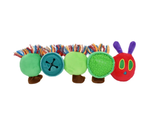 A colourful Happy Pet plush caterpillar treat dog toy on a plain white background. The toy features green body segments with multicoloured fringe, a blue button segment, a green textured segment, and a red head with purple antennae and green eyes.