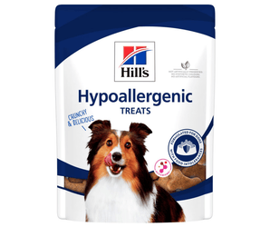Hills Hypoallergenic dog treats packaged in a white bag with an adult brown and white collie dog pictured on the bag. Text on bag say 'Hill's, Hypoallergenic Treats' on white background.