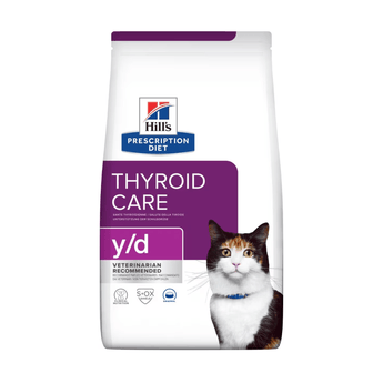 Hills Prescription Diet Y/D Thyroid Care dry cat food packaged in a white bag with an adult tortoiseshell and white cat pictured on the bag. Text on bag says 'Hill's Prescription Diet, Thyroid Care' and 'Y/D', Veterinarian recommended' pictured on white background.