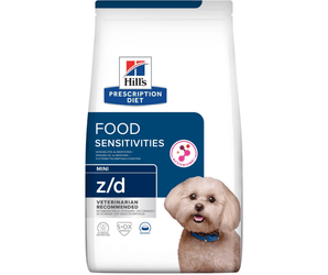 Hills Prescription Diet Food Sensitivities dry dog food packaged in a white bag with an adult bichon frise pictured on the bag. Text on bag says 'Hill's Prescription Diet, Food Sensitivities' and 'Mini Z/D, Veterinarian recommended' pictured on white background.