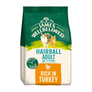 White background with a bag of James Wellbeloved Hairball Turkey Cat Food. Packaging is green and cream with 2 cats pictured, with text 'Hairball Adult, 1-7years, Rich in Turkey'.