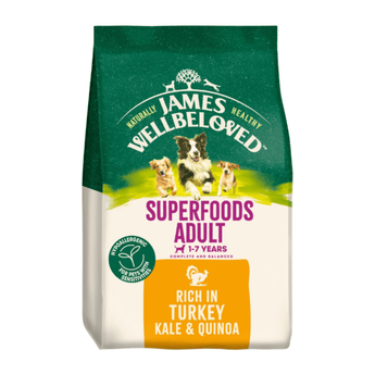 White background with a bag of James Wellbeloved Superfoods Turkey, Kale and Quinoa. Packaging is green and cream with 3 dogs pictured, with text 'Superfoods Adult, Dog 1-7years, Rich in Turkey, Kale & Quinoa'.