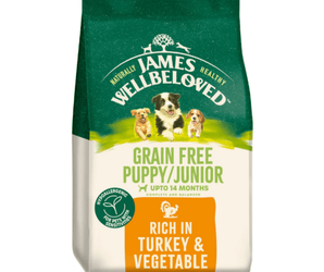 White background with a bag of James Wellbeloved Grain Free Turkey & Vegetable Puppy/Junior Food. Packaging is green and cream with 3 dogs pictured, with text 'Grain Free Puppy/Junior , Upto 14 months, Rich in Turkey and Vegetables'.