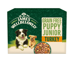 White background with a box of James Wellbeloved Grain Free Turkey Puppy Wet Food. The box is green and cream with 2 puppies pictured on the box.