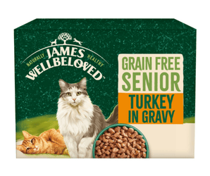 White background with a box of James Wellbeloved Turkey Senior Wet Food. The tin is green and cream with 2 cats pictured, with text 'Grain Free Senior, Turkey in Gravy.